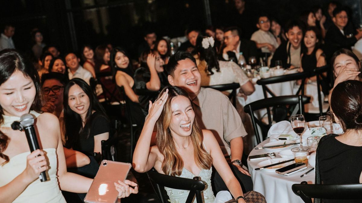 Guests laughing during a celebration game