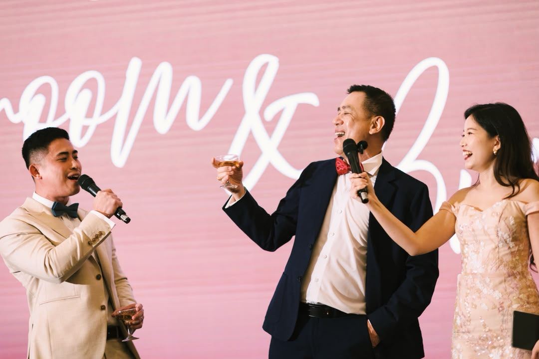 Toasting on stage at a wedding celebration